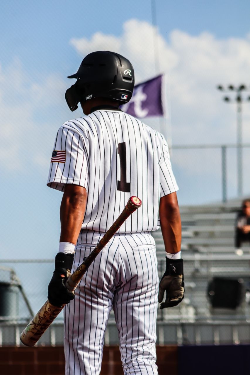 Aleck Hunte walking to the plate with bat in hand